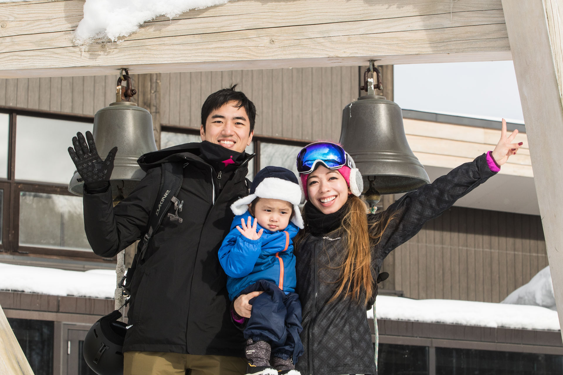 chinese-new-year-niseko-1 Family enjoying their Chinese New Year holiday outdoors in Niseko, Japan with snow and ski gear.