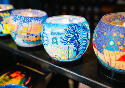 Sapporo-themed glowing glass candle holders featuring the city's famous Clock Tower landmark and winter scenes.