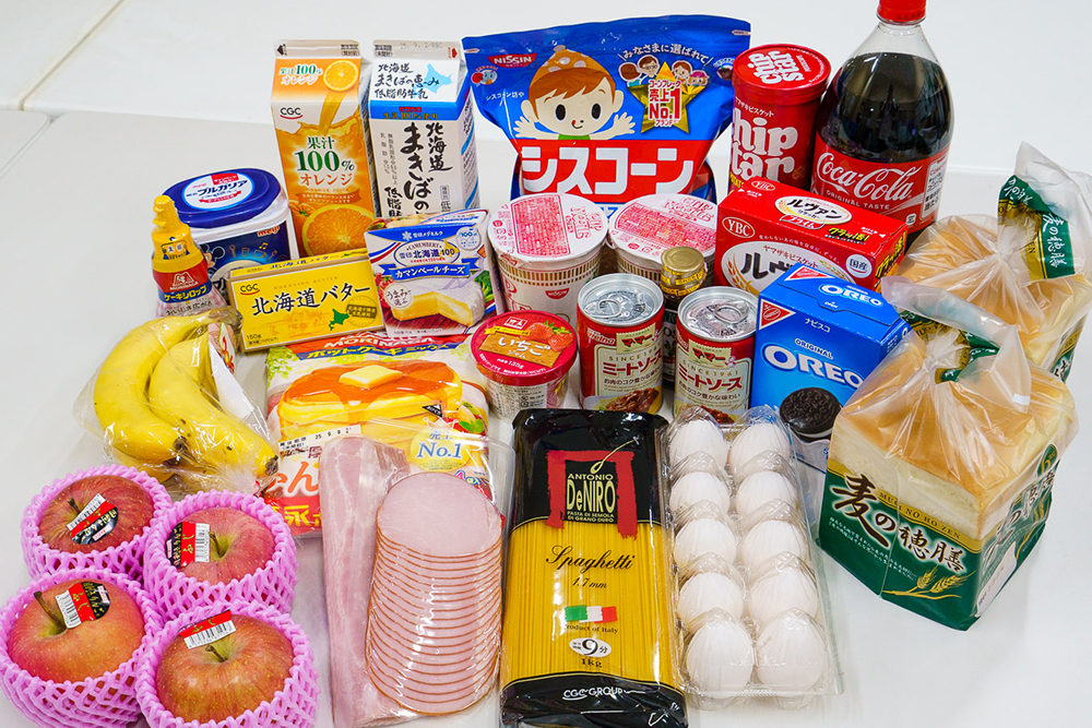 Gourmet grilled salmon dish with mushrooms and greens on white plate.